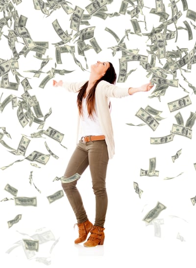 Excited woman under a money rain - isolated over a white background Excited woman under a money rain - isolated over a white background